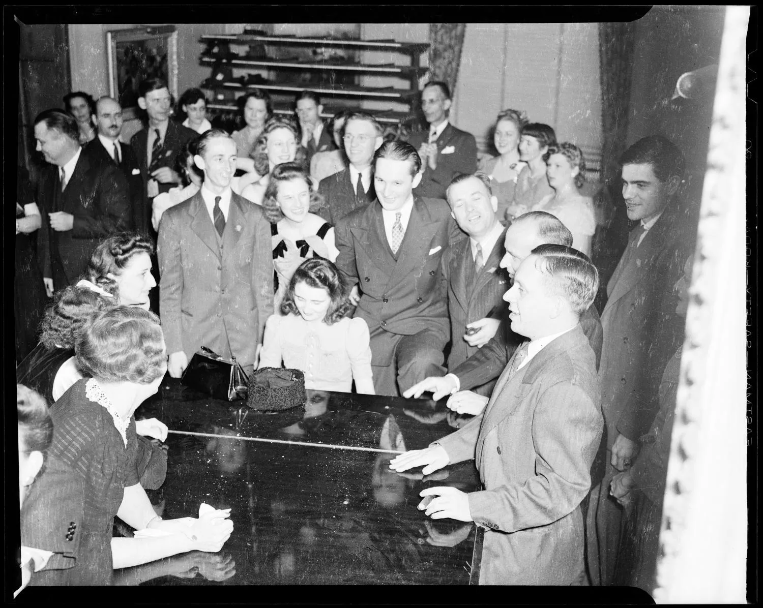 People Grouped Around Piano