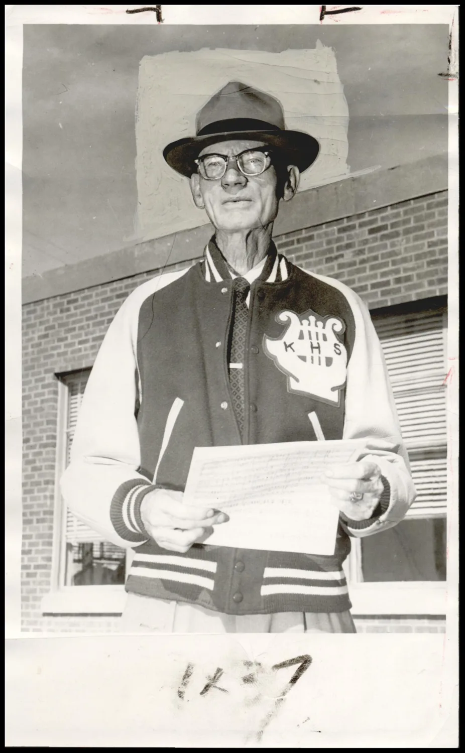 Photograph taken for a story in the Daily Oklahoman newspaper. Caption: "The concert marks the 20th anniversary of its beloved maestro, A. E. Findley, who has watched the band grow from 34 members in all grades when he organized it in 1937 to now number 184, well over half the Kingston school enrollment."