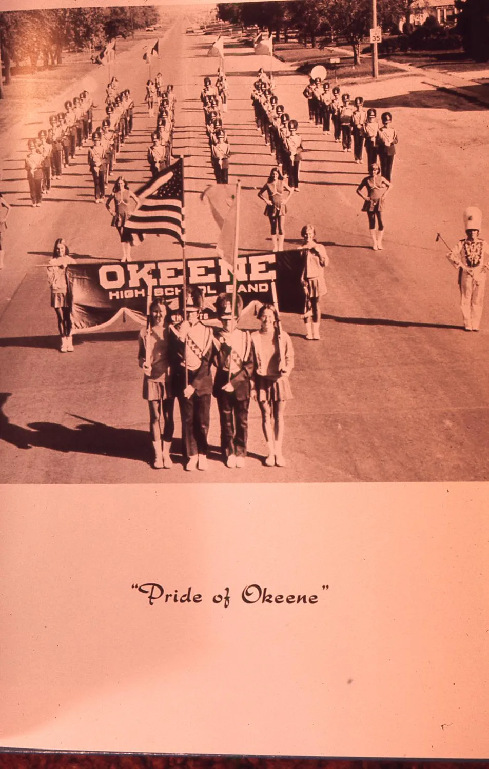 Photograph of Okeene annual page, picture of band in the street, 1975.