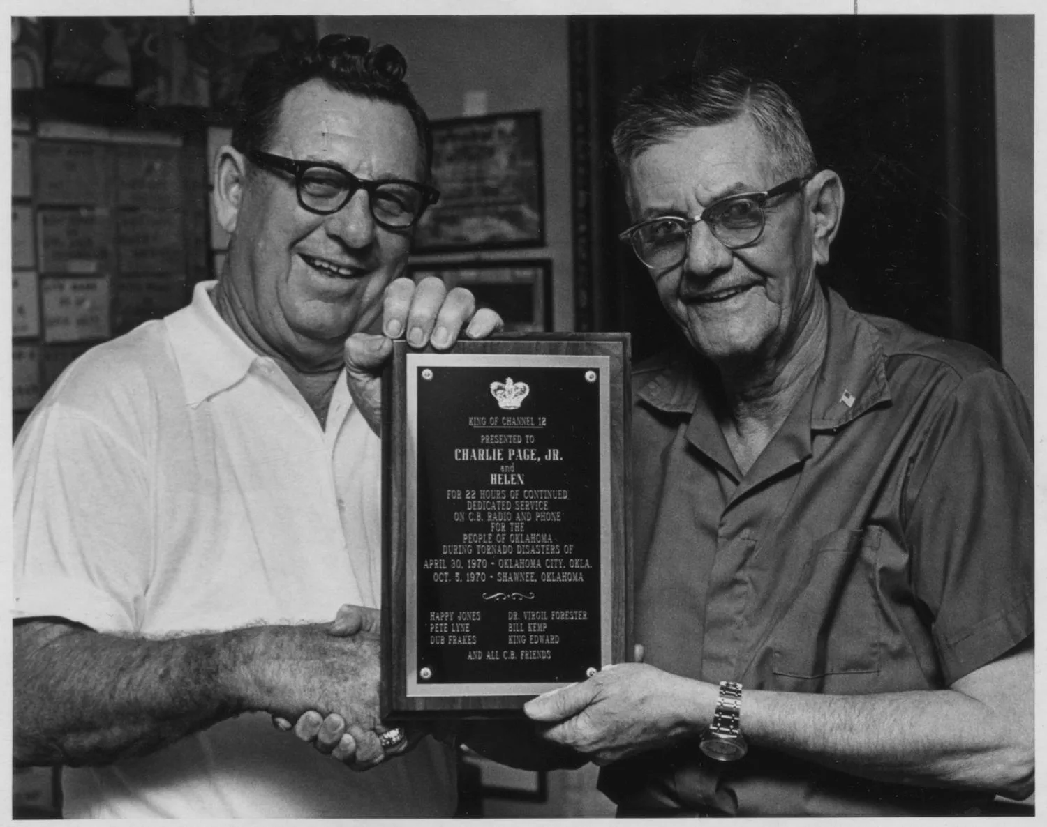"Page Charles Jr. (presented plaque by the ""Channel 12 Family"")".