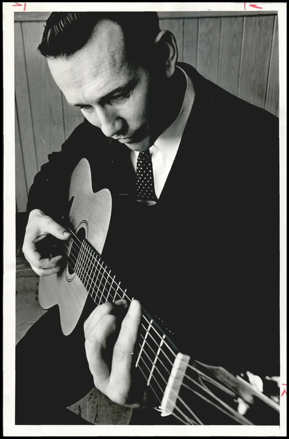 Photograph used for a story in the Oklahoma Times newspaper. Caption: "Guitar music has more soul than most folks might think, Rev. Bob Ireton feels."