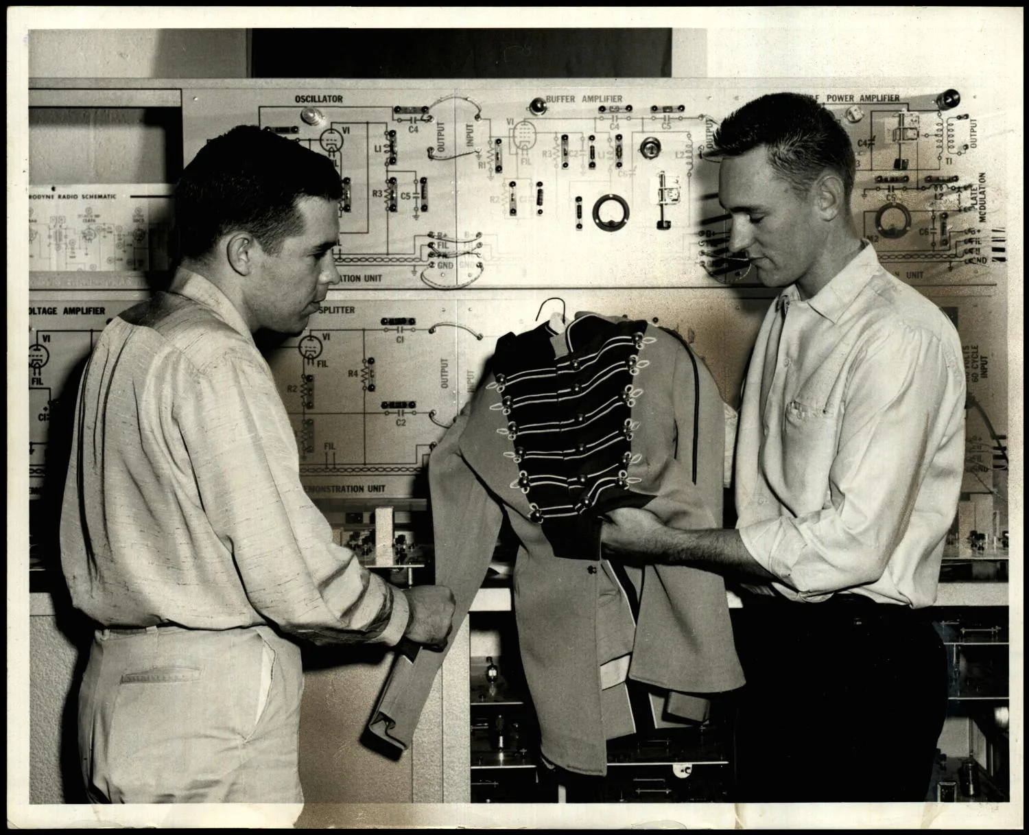 Photograph used for a story in the Oklahoma Times newspaper. Caption: "Bailey McDaniel, (right), electronics student at Oklahoma State Tech, Okmulgee, from McLoud, remembers the year he worked making band uniforms to help pay his school expenses,."