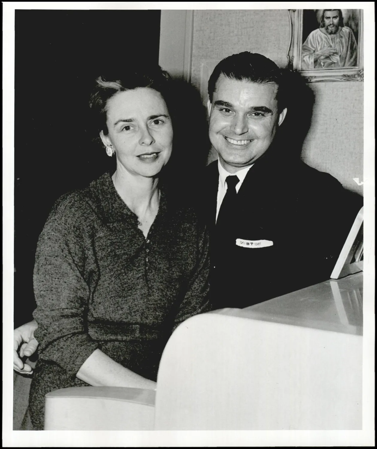 Photograph used for a newspaper owned by the Oklahoma Publishing Company. Caption: "Rev. Thomas' decision to turn from law to the ministry was made with wholehearted approval of Mr. Thomas, a talented musician and now choir director for the First Methodist church of Sallisaw."