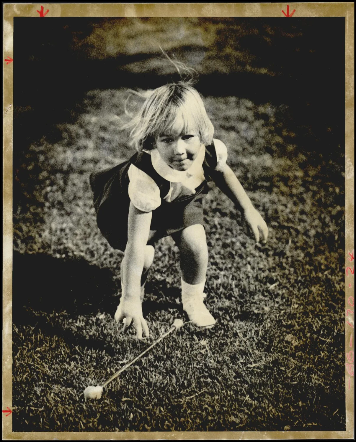 Photograph used for a story in the Oklahoma Times newspaper. Caption: "Little, four-year-old Mysti Tullis missed her baton, but didn't miss the game. The young twitler, who is a mascot for the Capitol Hill Redskins Band was on hand at the Oklahoma City Prep Football Preview Thursday night at Taft Stadium"