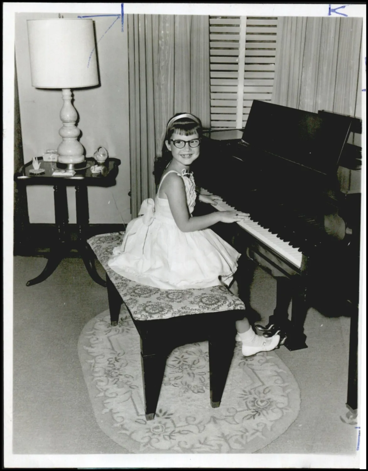 Photograph used for a story in the Daily Oklahoman newspaper. Caption: "Rhonda Ward, an accomplished musician at the age of 7."